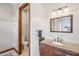 Charming bathroom featuring elegant vanity, granite countertops, and a separate powder room at 5523 W Creekside Ln, San Tan Valley, AZ 85144