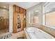 This bathroom is equipped with a jetted tub, standing shower, and dry sauna at 5523 W Creekside Ln, San Tan Valley, AZ 85144