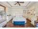 Serene bedroom features hardwood floors, a tray ceiling, and a cozy sitting area for relaxation at 5523 W Creekside Ln, San Tan Valley, AZ 85144