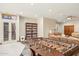 Entertaining game room with natural lighting, foosball table, shelving and open concept access to Gathering area at 5523 W Creekside Ln, San Tan Valley, AZ 85144