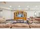 Comfortable living room with neutral furniture, built-in media center, and ample space for relaxing at 5523 W Creekside Ln, San Tan Valley, AZ 85144
