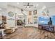 Living room with tile flooring, ceiling fan and large open arched doorway at 5523 W Creekside Ln, San Tan Valley, AZ 85144