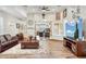 Open-concept living room with hard wood floors, comfortable furniture, and natural light at 5523 W Creekside Ln, San Tan Valley, AZ 85144