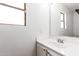 Bright bathroom with a white sink and a large mirror at 559 W Viola St, Casa Grande, AZ 85122