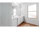 Bathroom with a large double sink vanity, bright lighting and a big window at 559 W Viola St, Casa Grande, AZ 85122