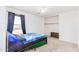 Carpeted bedroom with a bed, closet and window for lots of natural light at 559 W Viola St, Casa Grande, AZ 85122