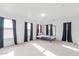 Spacious carpeted bedroom with four windows for lots of natural light at 559 W Viola St, Casa Grande, AZ 85122