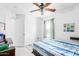 This bedroom has carpet flooring, a ceiling fan and a window with curtains at 559 W Viola St, Casa Grande, AZ 85122