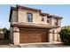 Two-story home featuring a tile roof and a spacious two-car garage at 559 W Viola St, Casa Grande, AZ 85122