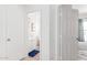 View of a hallway leading to a bathroom and another room with carpet flooring at 559 W Viola St, Casa Grande, AZ 85122