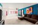 Living room featuring modern artwork, plush seating and ample natural light at 559 W Viola St, Casa Grande, AZ 85122