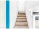 Bright staircase with neutral carpet leads to the upper level, showcasing clean lines and a modern design at 559 W Viola St, Casa Grande, AZ 85122