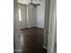 Cozy bedroom with wood-look flooring, a ceiling fan, and a bright window at 600 S Dobson Rd # 53, Mesa, AZ 85202