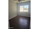 Comfortable bedroom showcasing wood-look flooring and a window at 600 S Dobson Rd # 53, Mesa, AZ 85202