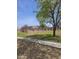 A gated community pool area is surrounded by mature landscaping and manicured lawns at 600 S Dobson Rd # 53, Mesa, AZ 85202