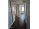 Hallway featuring wood-look floors and white doors leading to other rooms at 600 S Dobson Rd # 53, Mesa, AZ 85202