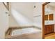 Bathroom features a soaking tub and adjacent vanity with wood cabinets at 6122 E Harvard St, Scottsdale, AZ 85257