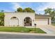 Charming home featuring a gated entrance, stucco walls, and lush lawn at 6122 E Harvard St, Scottsdale, AZ 85257