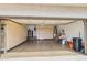 Organized garage with ample storage cabinets and a clean epoxy floor provides plenty of space for vehicles and projects at 6122 E Harvard St, Scottsdale, AZ 85257