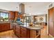 Chef's kitchen featuring custom cabinetry and a large island for entertaining at 6122 E Harvard St, Scottsdale, AZ 85257