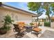 Relaxing patio with cozy seating arrangements, a decorative outdoor space ideal for enjoying the surrounding landscaping at 6122 E Harvard St, Scottsdale, AZ 85257