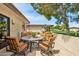 Inviting outdoor patio area with stone-paved flooring, comfortable seating arrangements, and views of lush landscaping at 6122 E Harvard St, Scottsdale, AZ 85257
