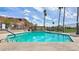 Refreshing community pool with clear turquoise water, ample lounging space, and views of the surrounding desert landscape at 6122 E Harvard St, Scottsdale, AZ 85257