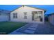 Backyard features a lush artificial lawn and a covered patio area at 6732 W Pedro Ln, Laveen, AZ 85339