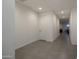 Neutral hallway featuring tiled floor and access to rooms with recessed lighting at 6732 W Pedro Ln, Laveen, AZ 85339