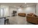 Spacious living area with tile flooring that flows into the open kitchen area at 6732 W Pedro Ln, Laveen, AZ 85339