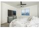 Modern primary bedroom features a mounted television and a window with views at 6732 W Pedro Ln, Laveen, AZ 85339