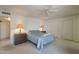 Light-filled bedroom with two bedside tables, and a view into the bathroom area at 7925 E Monte Ave, Mesa, AZ 85209