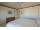 Bright bedroom with a large closet and light carpet and walls at 7925 E Monte Ave, Mesa, AZ 85209
