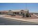 Charming single-story home with desert landscaping, tile roof, and attached two-car garage at 7925 E Monte Ave, Mesa, AZ 85209