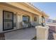 Charming front porch featuring seating area, and attractive security screen door at 7925 E Monte Ave, Mesa, AZ 85209