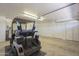 The garage includes a golf cart, side door, and storage area at 7925 E Monte Ave, Mesa, AZ 85209