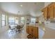 Bright kitchen and eating area with tile floors and access to the outdoor patio, great for everyday living at 7925 E Monte Ave, Mesa, AZ 85209