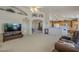 The open living room features vaulted ceilings, decorative ledges, neutral colors, and opens to the kitchen at 7925 E Monte Ave, Mesa, AZ 85209