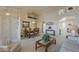 Open-concept living and dining area features carpet, vaulted ceilings, and bright lighting at 7925 E Monte Ave, Mesa, AZ 85209