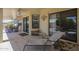 Outdoor patio with ceiling fan, tiled floor, furniture, and desert landscaping at 7925 E Monte Ave, Mesa, AZ 85209