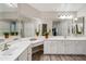 Large bathroom vanity with dual sinks, lots of storage, and a large mirror at 8405 W Utopia Rd, Peoria, AZ 85382