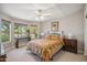 Bright and inviting bedroom with large windows and cozy floral bedding at 8405 W Utopia Rd, Peoria, AZ 85382
