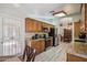 Bright kitchen with wood cabinets, granite countertops, and stainless steel appliances at 8405 W Utopia Rd, Peoria, AZ 85382