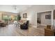 Spacious living room featuring patio access, neutral decor, and comfortable seating arrangements at 8405 W Utopia Rd, Peoria, AZ 85382