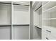 Walk-in closet featuring ample shelving and drawers at 8719 E San Marcos Dr, Scottsdale, AZ 85258