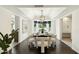 Dining area featuring a modern chandelier and large windows at 8719 E San Marcos Dr, Scottsdale, AZ 85258