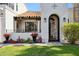 Close-up shot of the front door, desert landscaping, and white exterior paint at 8719 E San Marcos Dr, Scottsdale, AZ 85258