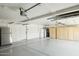 Spacious garage with epoxy floors and ample storage cabinets at 8719 E San Marcos Dr, Scottsdale, AZ 85258