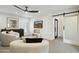 Comfortable sitting area with a ceiling fan and desert art at 8719 E San Marcos Dr, Scottsdale, AZ 85258