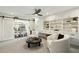 Open floor plan with adjacent dining area and a sliding barn door at 8719 E San Marcos Dr, Scottsdale, AZ 85258